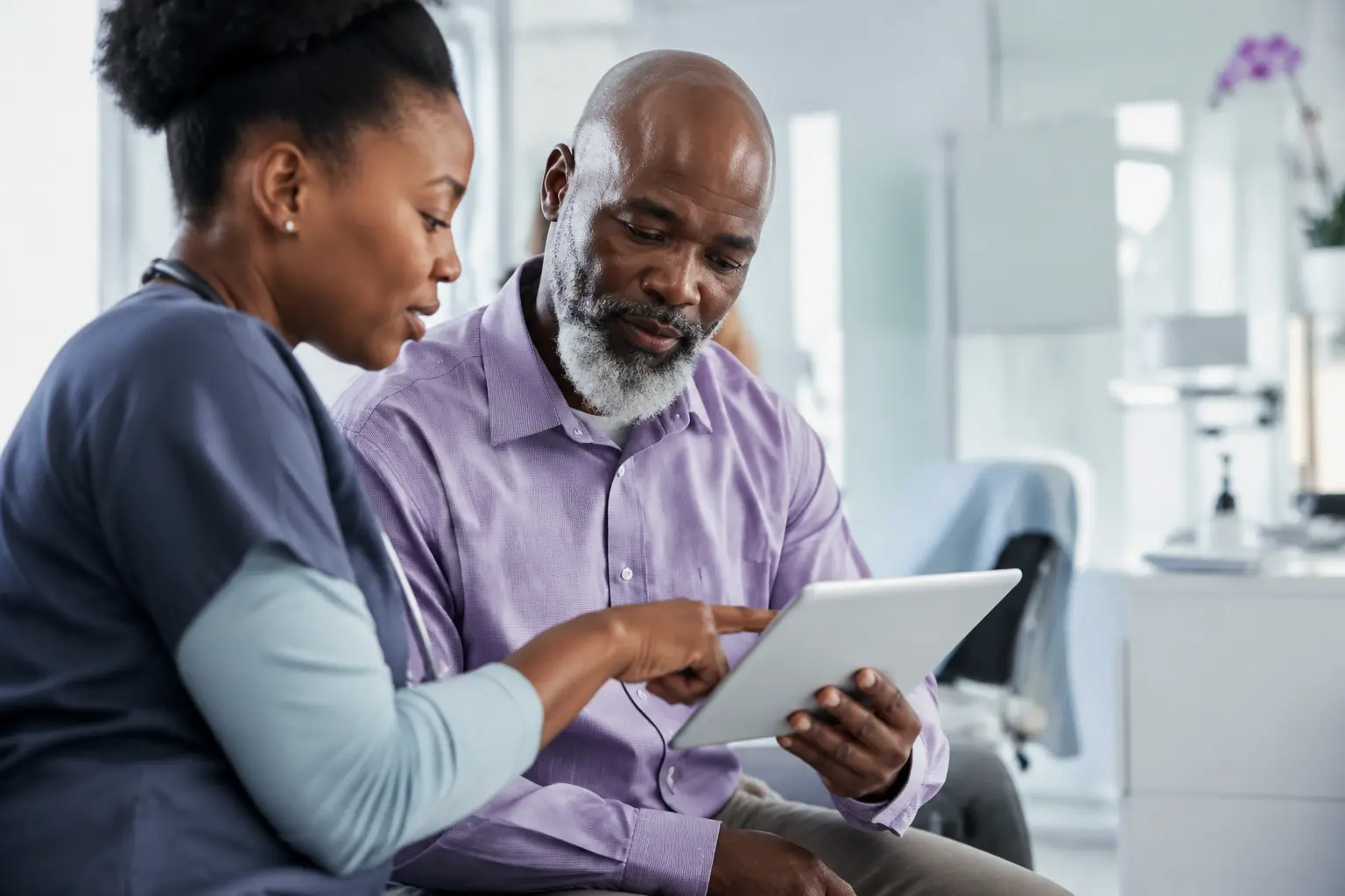 A clinician and patient reviewing information together