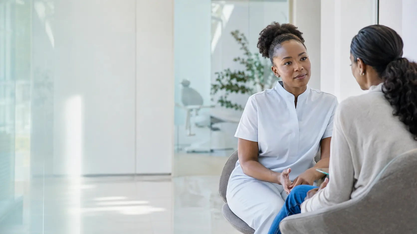 A healthcare professional listening carefully during a consultation
