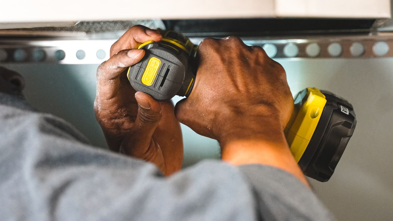 A home services professional working carefully in a bright, modern home